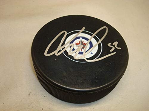 Jack Roslovic assinou o Winnipeg Jets Hockey Puck autografado 1b - Pucks autografados da NHL