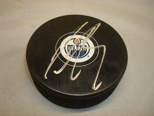 Justin Schultz assinou o Edmonton Oilers Hockey Puck PSA/DNA COA 1B - Pucks autografados da NHL
